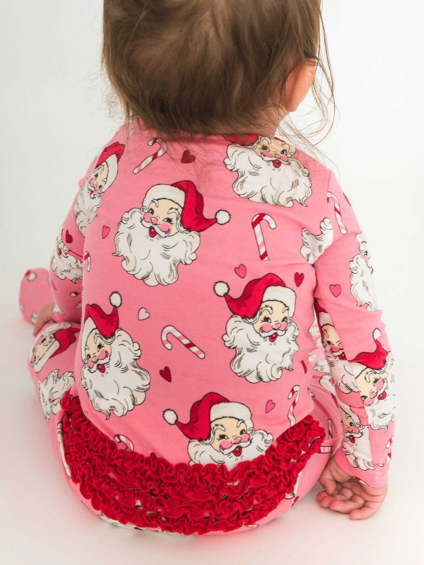 RuffleButts SoftSnooze™ Baby Girls Cotton Modal Pink Santa Joy Footed Ruffle One Piece Pajama