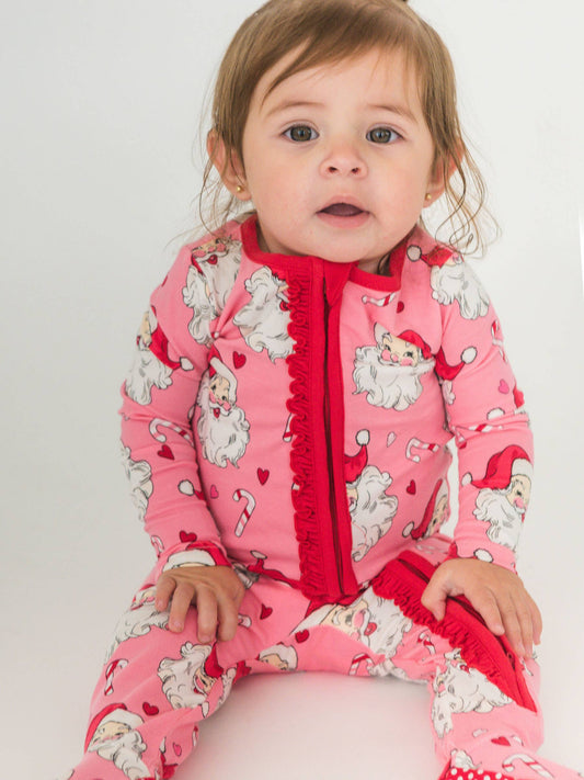 RuffleButts SoftSnooze™ Baby Girls Cotton Modal Pink Santa Joy Footed Ruffle One Piece Pajama