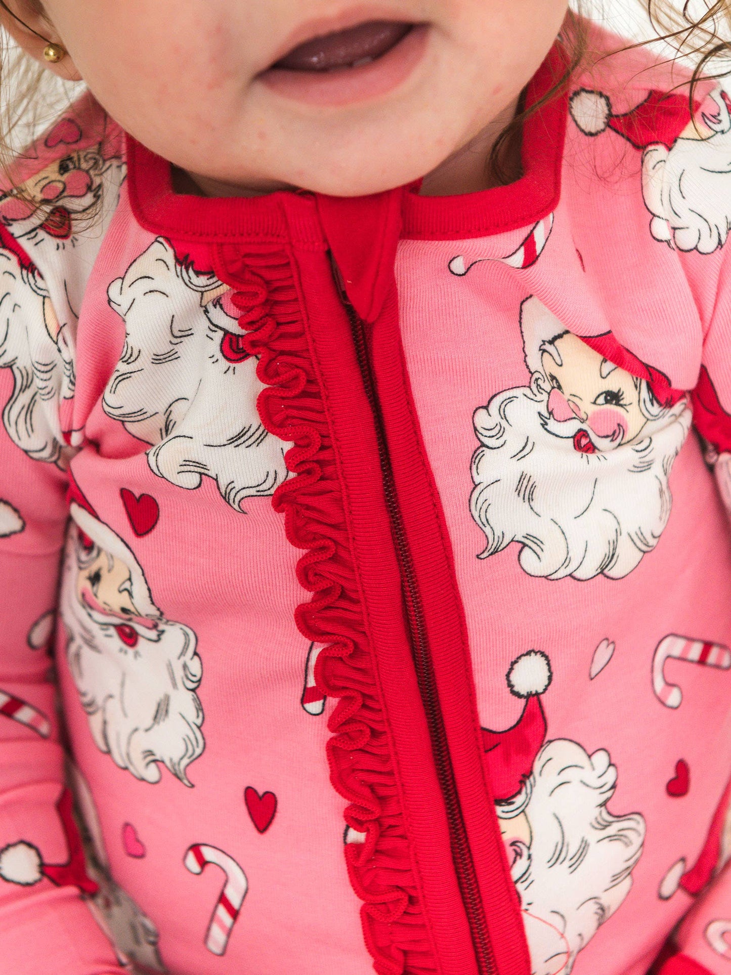 RuffleButts SoftSnooze™ Baby Girls Cotton Modal Pink Santa Joy Footed Ruffle One Piece Pajama