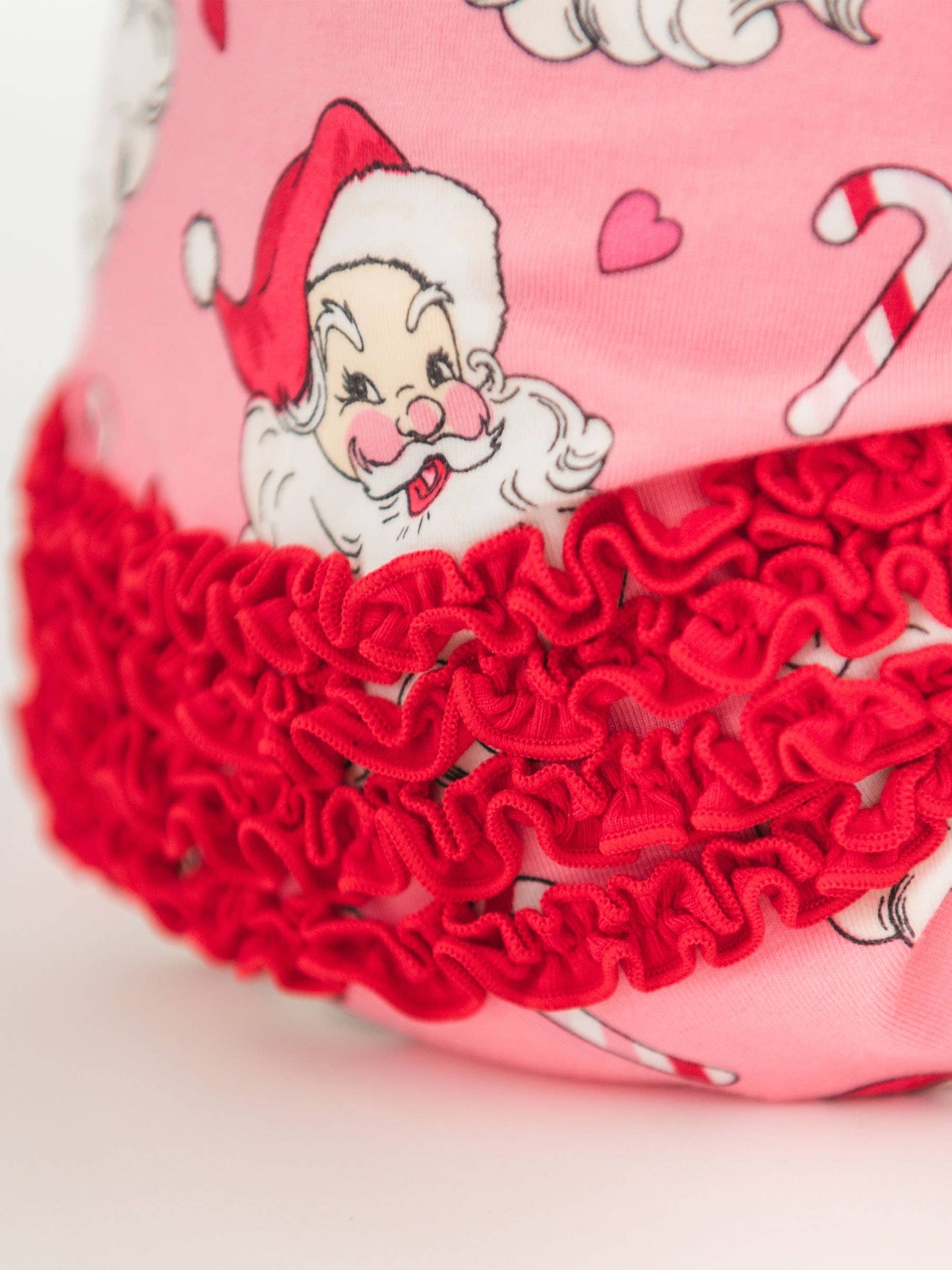 RuffleButts SoftSnooze™ Baby Girls Cotton Modal Pink Santa Joy Footed Ruffle One Piece Pajama