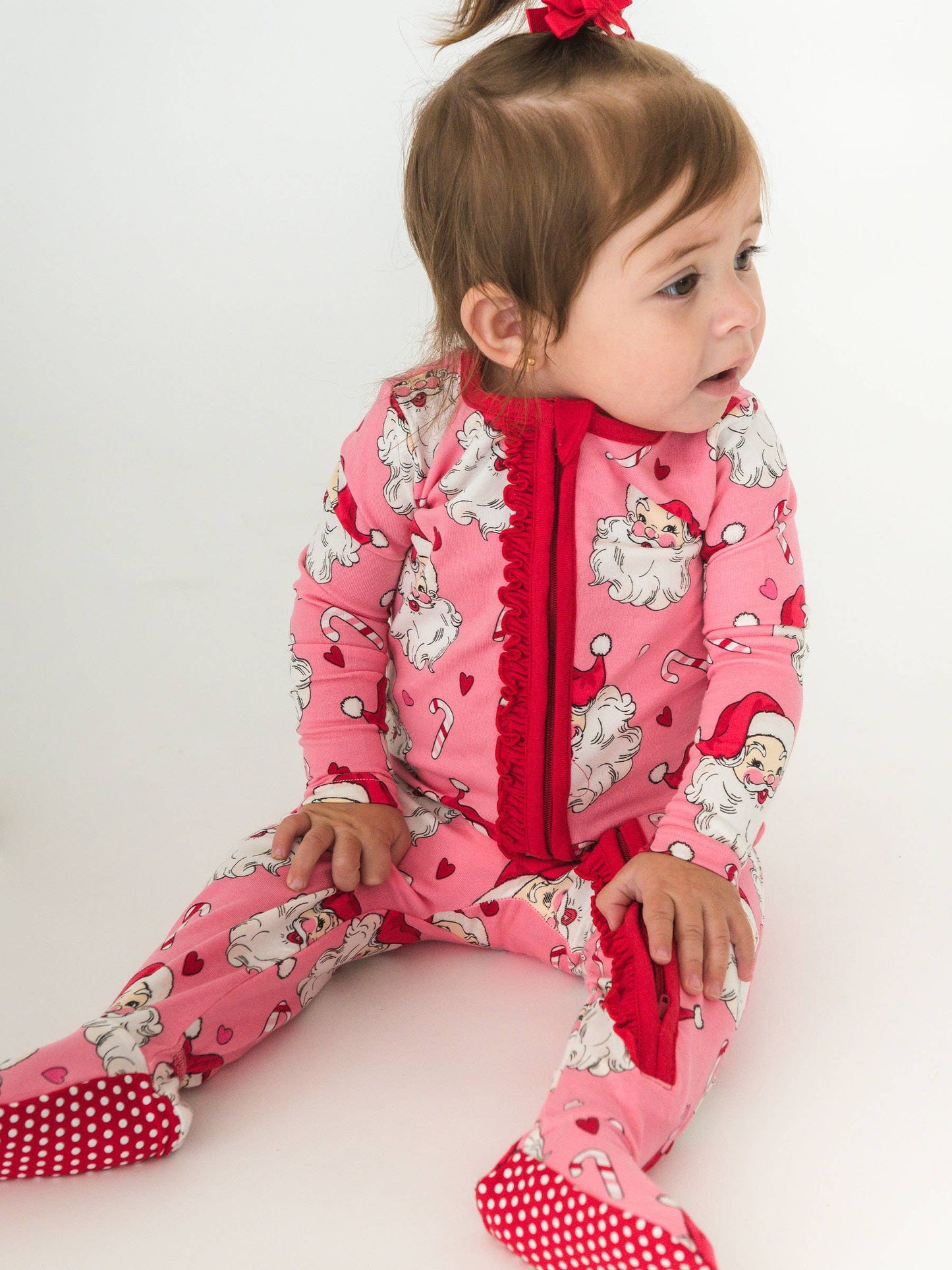 RuffleButts SoftSnooze™ Baby Girls Cotton Modal Pink Santa Joy Footed Ruffle One Piece Pajama